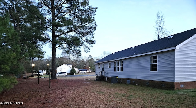 view of property exterior with central AC unit