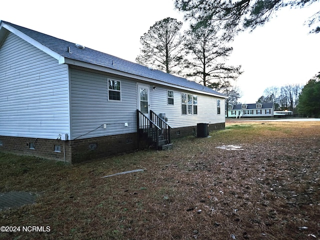 back of house featuring central air condition unit