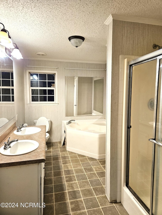 full bathroom featuring shower with separate bathtub, toilet, double sink, oversized vanity, and a textured ceiling