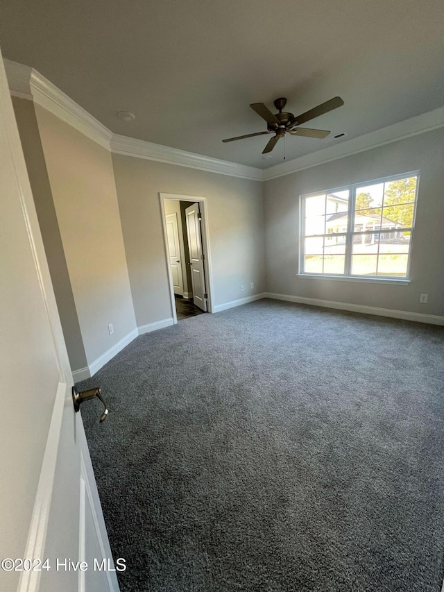 carpeted empty room featuring ceiling fan and ornamental molding