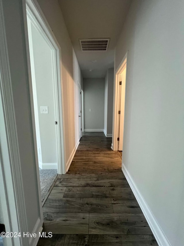 hall with dark hardwood / wood-style floors