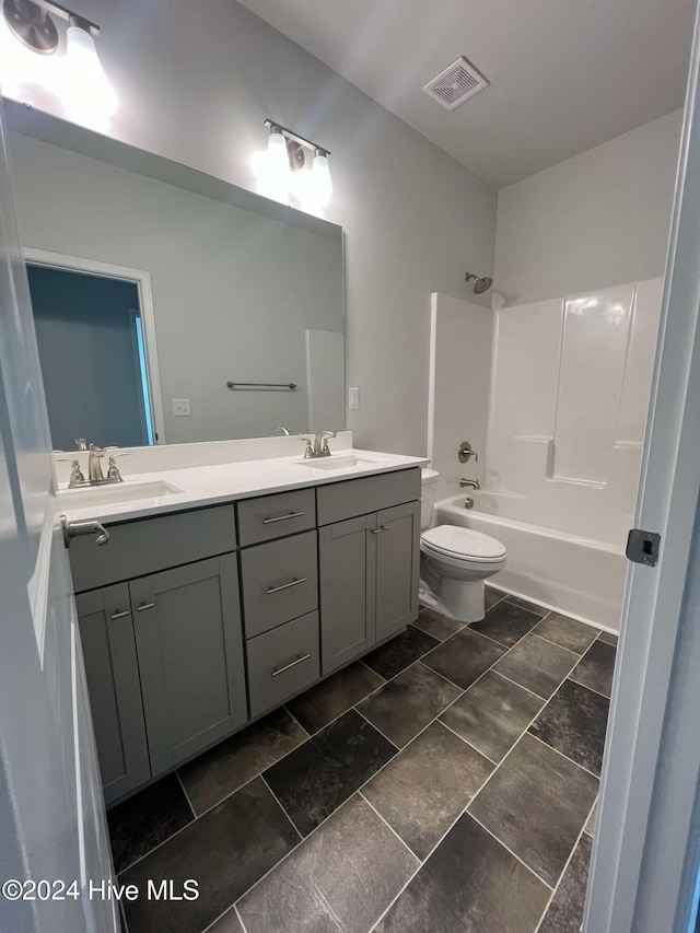 full bathroom featuring vanity, toilet, and shower / washtub combination