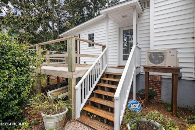 doorway to property featuring ac unit