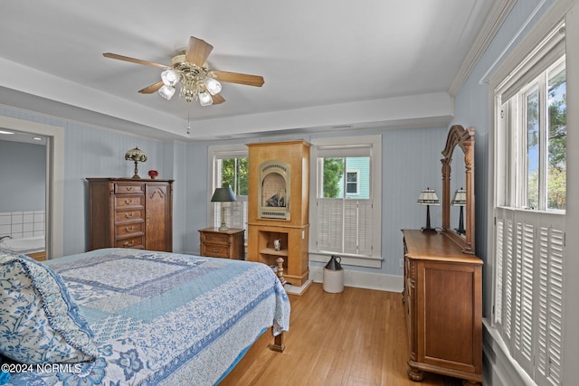 bedroom with light hardwood / wood-style floors and ceiling fan