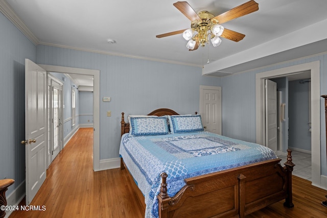 bedroom featuring light hardwood / wood-style flooring, ceiling fan, and ornamental molding