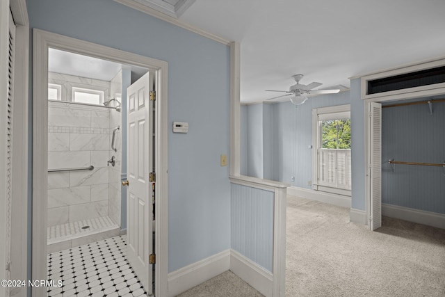 interior space featuring ceiling fan, tile patterned flooring, tiled shower, and ornamental molding