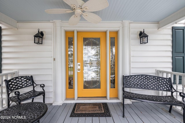 entrance to property featuring ceiling fan