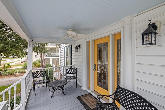 wooden deck featuring ceiling fan and a porch