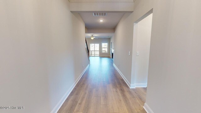 kitchen featuring dark wood-type flooring, a premium fireplace, sink, and a center island with sink