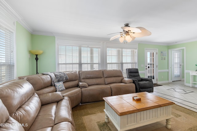 living room with ceiling fan, crown molding, and light tile patterned flooring