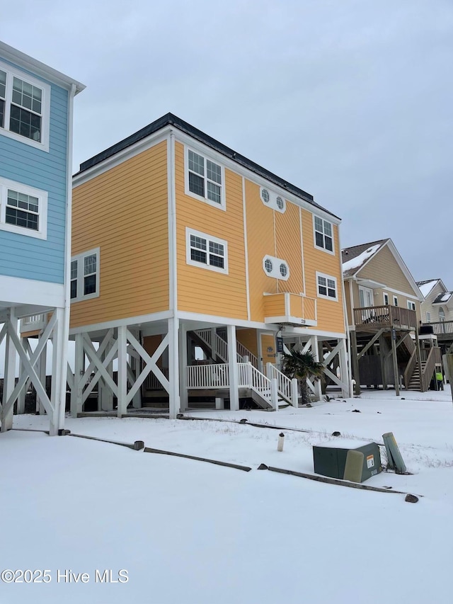 view of snow covered house