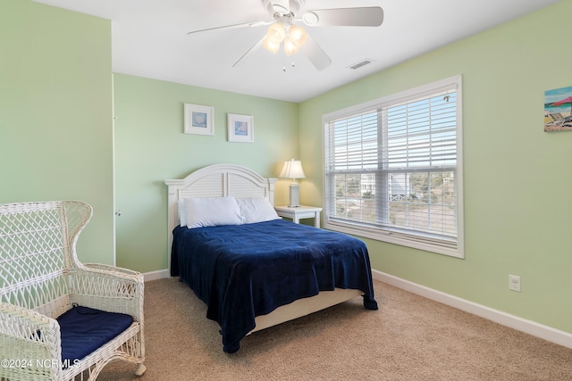 carpeted bedroom with ceiling fan