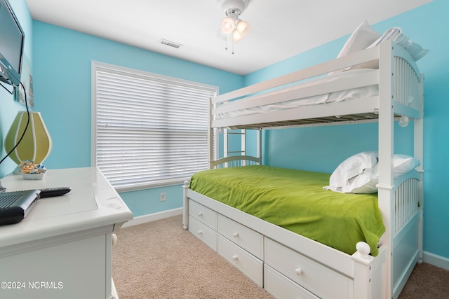 bedroom featuring light colored carpet