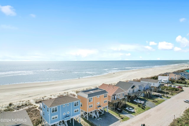 bird's eye view with a water view and a view of the beach