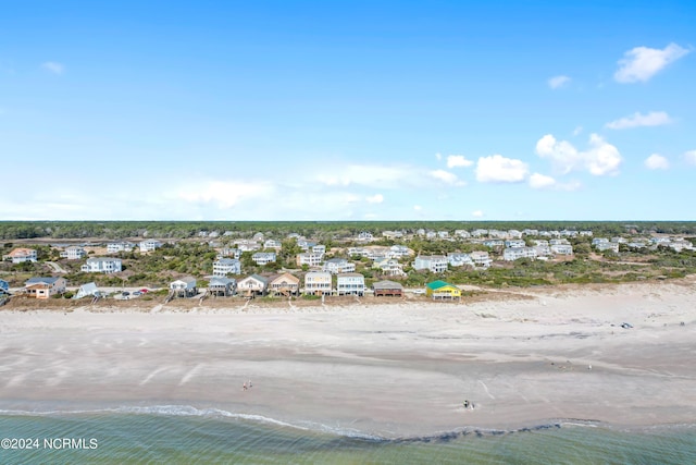 bird's eye view featuring a water view and a view of the beach