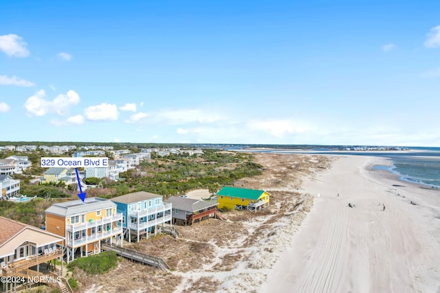 aerial view with a beach view and a water view