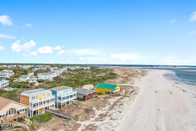 aerial view featuring a water view and a beach view