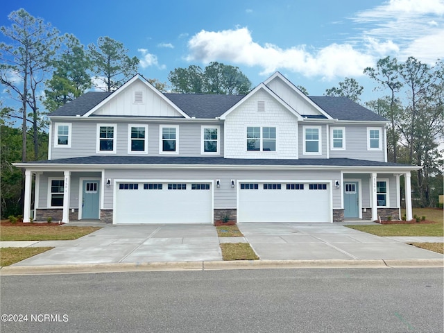 view of front of home featuring a garage and a porch