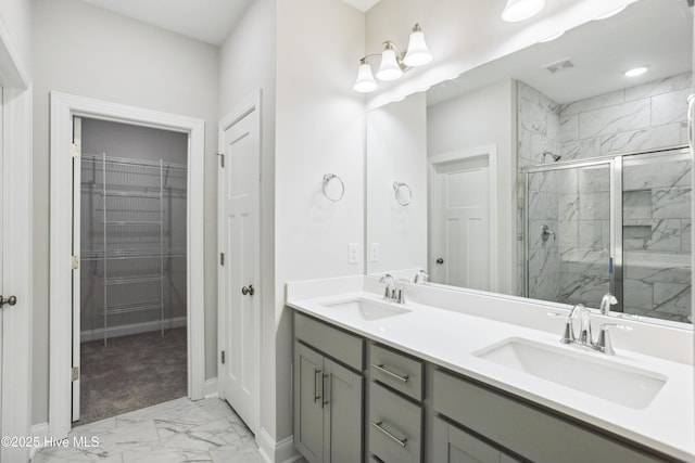 bathroom featuring vanity and a shower with shower door