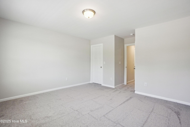 spare room with light colored carpet