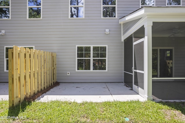 exterior space with a patio and a sunroom