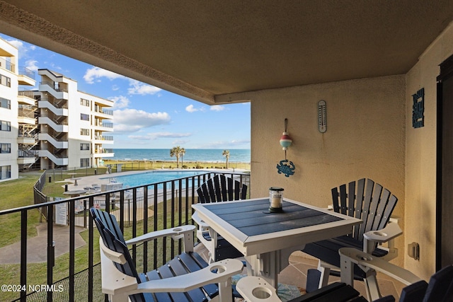 balcony featuring a water view