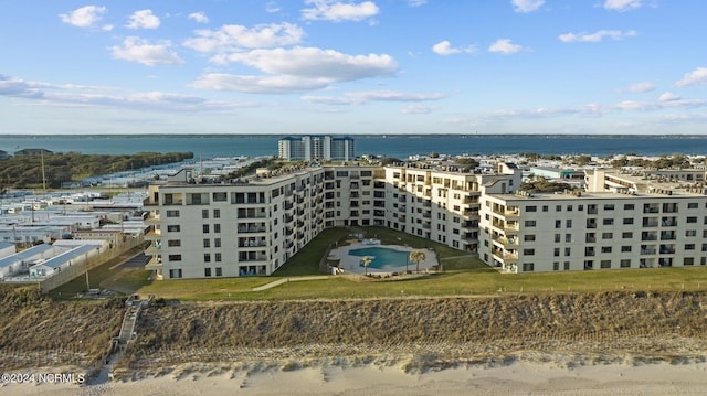 birds eye view of property with a water view