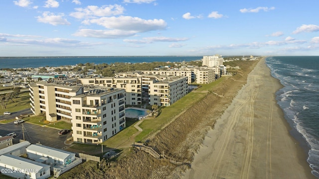 aerial view with a water view and a view of the beach