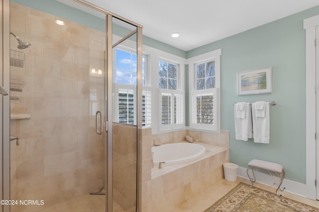 bathroom with tile floors and separate shower and tub