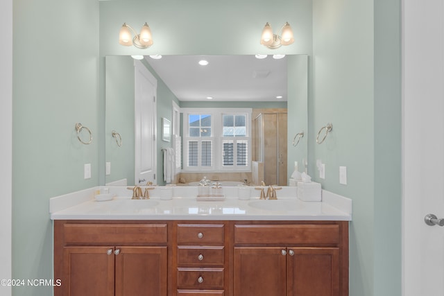 bathroom featuring dual sinks and vanity with extensive cabinet space