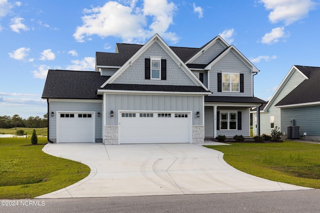 craftsman inspired home featuring central AC, a garage, and a front lawn