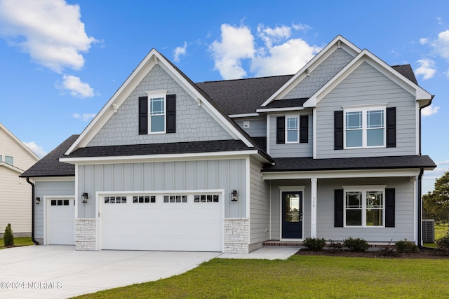 craftsman-style house with a front yard and a garage