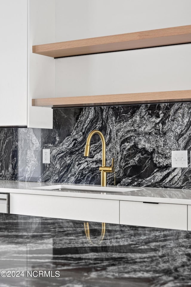 interior details with sink and backsplash