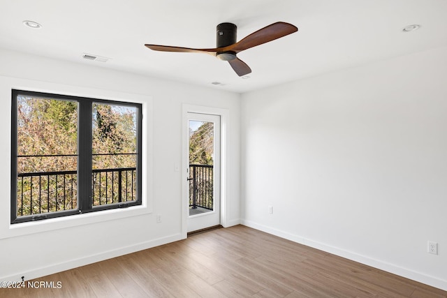 spare room featuring ceiling fan and wood-type flooring