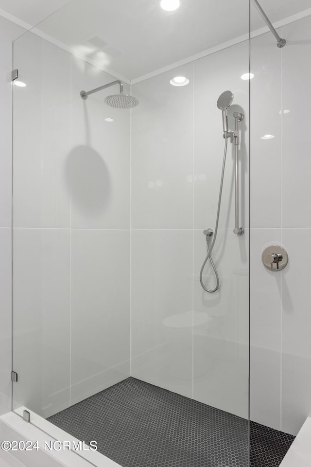 bathroom with a tile shower