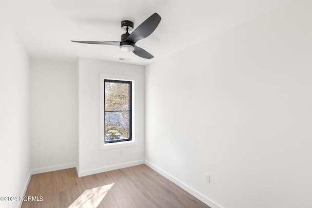 unfurnished room with ceiling fan and light hardwood / wood-style floors