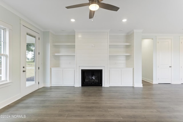 2058 Greenside Manor Dr, Ocean Isle Beach, NC 28469 - unfurnished living room with ceiling fan, crown molding, wood finished floors, and plenty of natural light