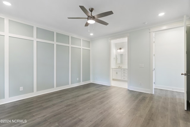 2058 Greenside Manor Dr, Ocean Isle Beach, NC 28469 - unfurnished bedroom with recessed lighting, dark wood finished floors, baseboards, and connected bathroom