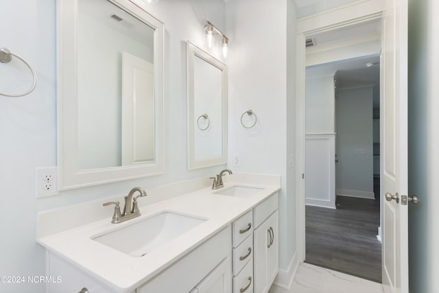2058 Greenside Manor Dr, Ocean Isle Beach, NC 28469 - bathroom featuring a sink, visible vents, and double vanity