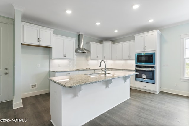 2058 Greenside Manor Dr, Ocean Isle Beach, NC 28469 - kitchen featuring black electric cooktop, oven, built in microwave, a sink, and wall chimney range hood
