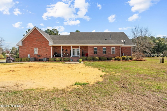 single story home featuring a front yard, central AC, and a porch