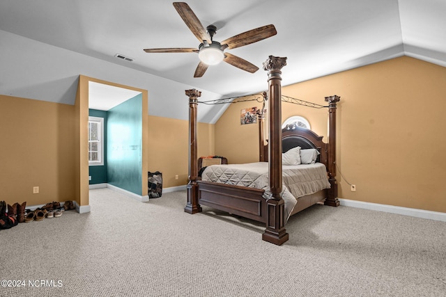 carpeted bedroom featuring ceiling fan and vaulted ceiling