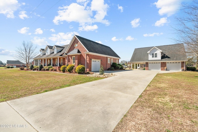 cape cod-style house with a front lawn and covered porch