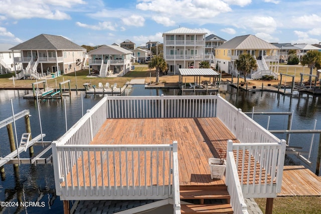 view of dock with a deck with water view