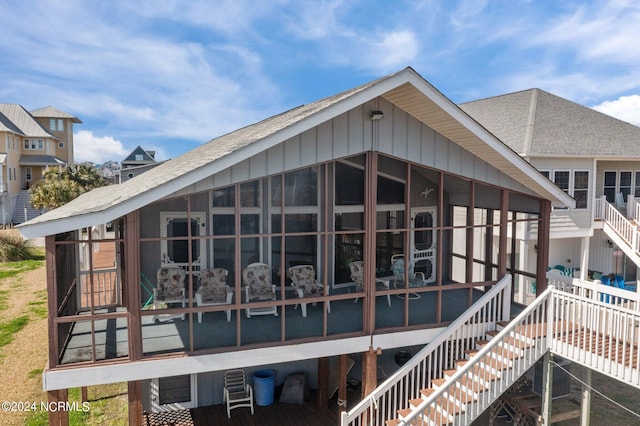 rear view of house with a sunroom