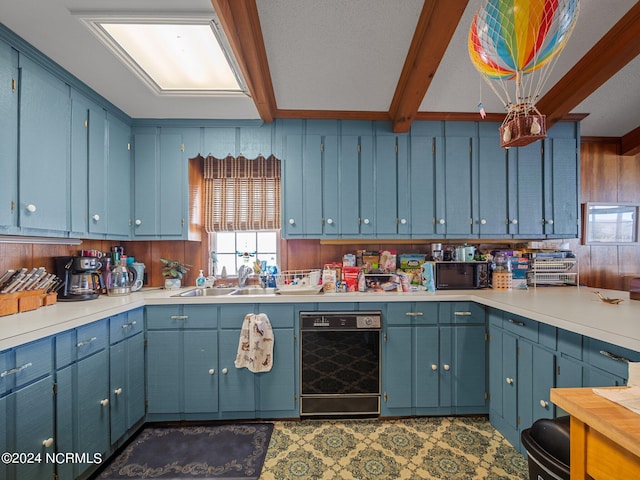 kitchen featuring sink, blue cabinets, beamed ceiling, and black dishwasher