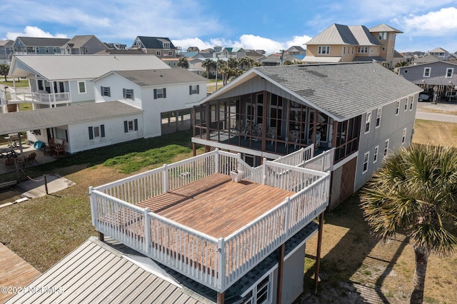 back of property featuring a yard and a deck