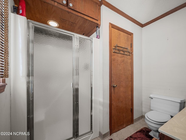 bathroom featuring tile patterned flooring, toilet, an enclosed shower, and ornamental molding