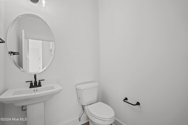 4865 Scarlet Sage Way, Shallotte, NC 28470 - half bathroom featuring toilet and baseboards