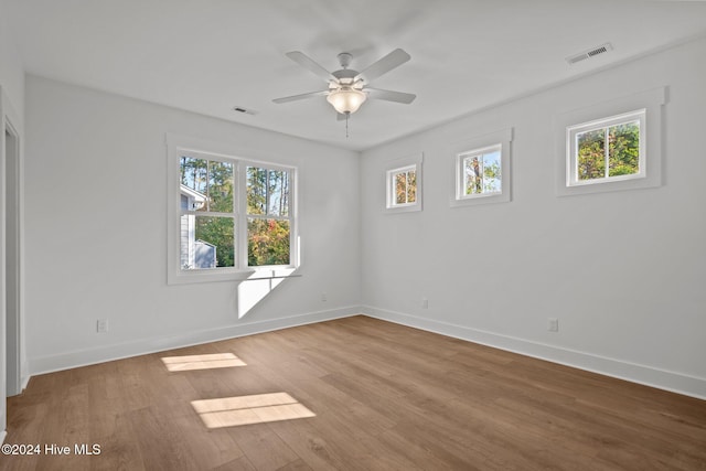 4865 Scarlet Sage Way, Shallotte, NC 28470 - empty room with wood finished floors and a ceiling fan